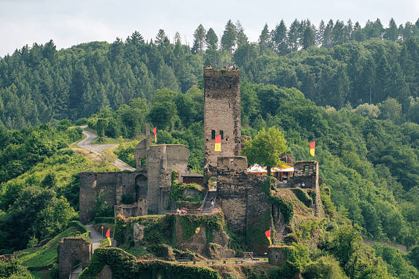 Burg Metternich Ruins on Forested Hill with Flags in Summer, Rhineland-Palatinate Germany