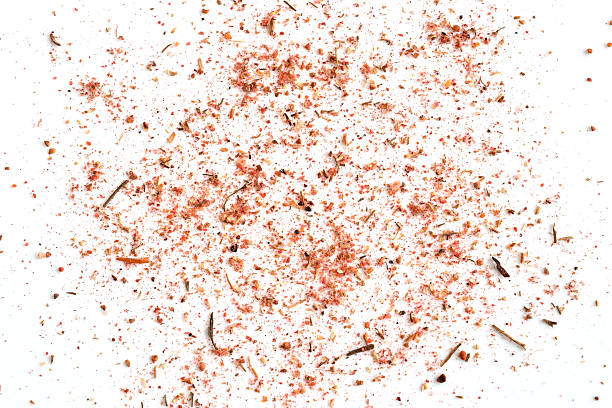 A hot spice mix for cooking chicken. The spice is isolated on a white background.