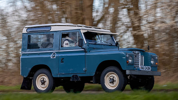 Milton Keynes,Bucks,UK - Mar 1st 2026:1974 blue Land Rover 88 classic  car driving on a British road