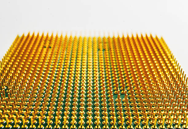 Macro close-up of gold contact pins on computer processor symbolizing cybersecurity and digital data protection. Concept of online security, digital safety and information defense.