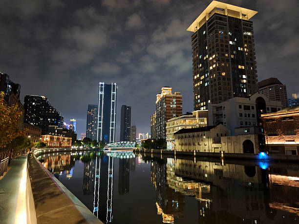 Skyline on Suzhou creek in Jing'an district at night, Shanghai, China