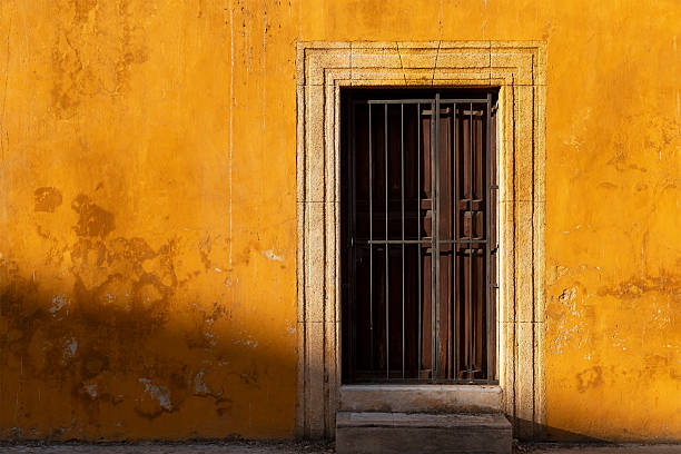 Yellow mexican colonial style facade at sunset, Izamal, Yucatan Peninsula, Mexico.