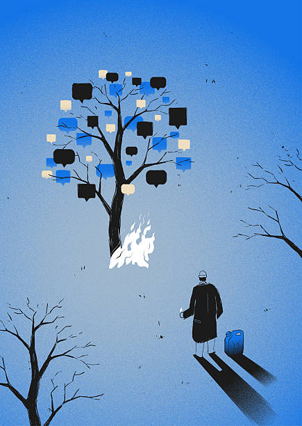 A man sets fire to the forest with a lighter and a gasoline canister. The burning tree symbolizes cybermobbing, cyberbullying, ghosting and trolling in a social media Chat.