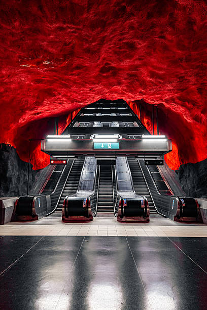 Stockholm metro station with red cave art and escalators