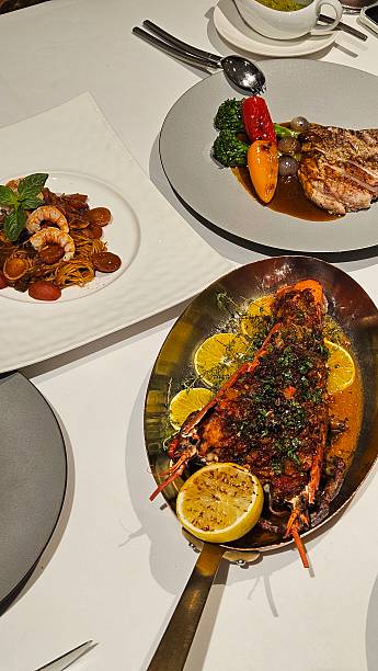 Grilled Lobster Served with Chicken Steak and Shrimp Pasta
