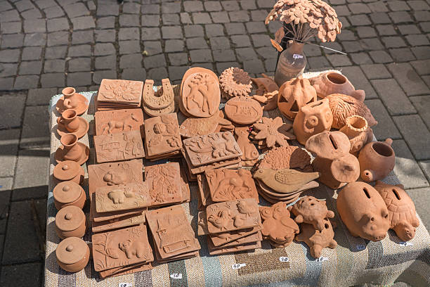 a collection of handmade ceramic and clay crafts at a fair in Romania, Bistrita, 2025