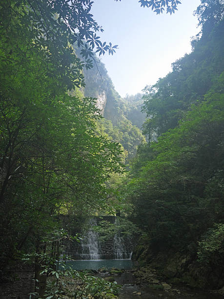 Old Chinese Dam or small water catchment across the mountain river in Zhangjiajie Grand Canyon, China