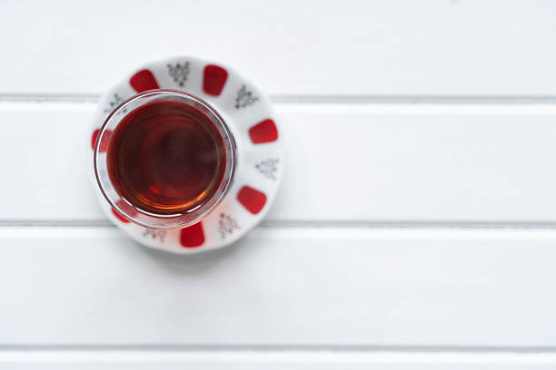 Glass of Turkish tea on wooden table