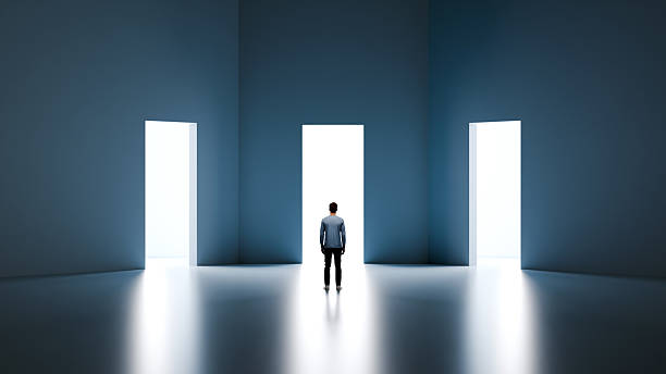 istock Man standing in front of three doorways with light representing professional choices and strategic career decisions, 3d render 2264770193