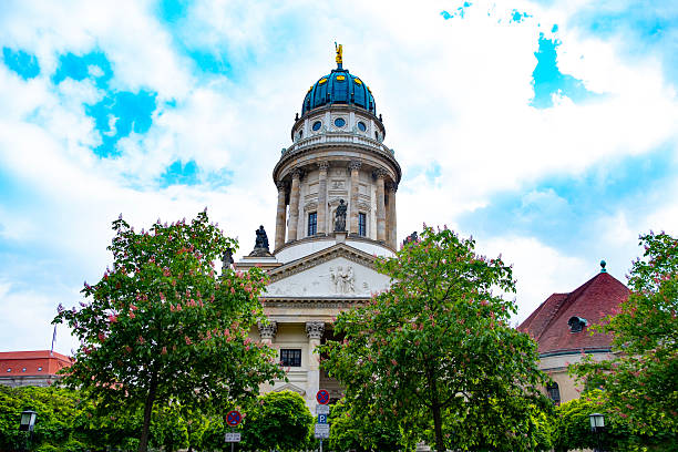 Majestic French Cathedral's dome in Berlin under bright sky. Architecture and history, Gendarmenmarkt square Historical landmark, Culture and travel, historical tourist attractions