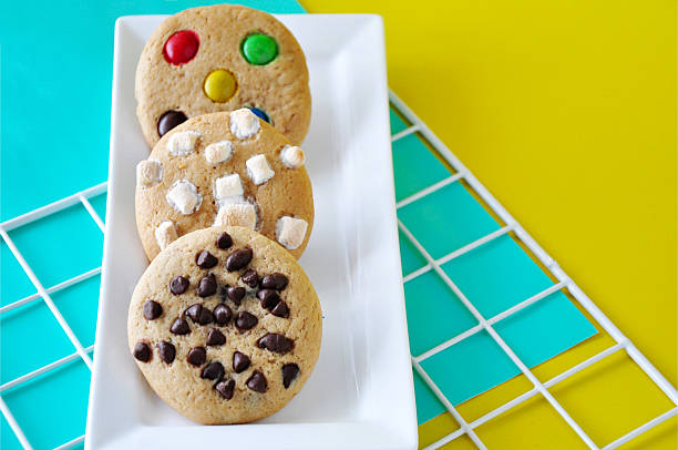 Different Kinds of Homemade Soft Cookies on Bright Color Background with Copyspace