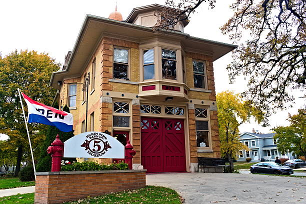 Elgin, IL  November 1, 2025: A sign stands in front of the Elgin Fire Barn 5, which is a historic building and museum of firefighting history.