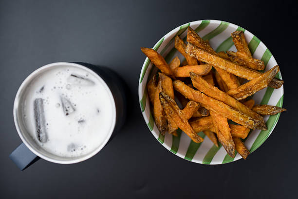 Golden sweet potato fries swerve with cool beer