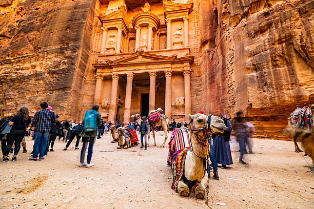 Large interesting tourist complex of the ancient city of Petra with tourists and camals