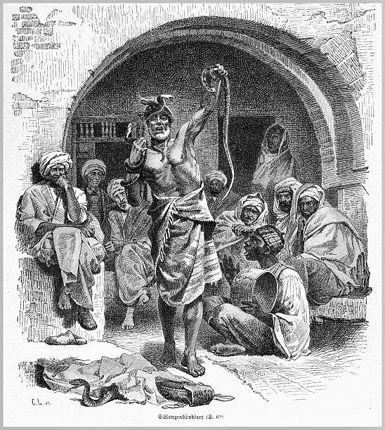 An intricate 19th-century illustration portrays a snake charmer captivating an audience in a North African setting. The scene is rich with cultural details and historical context, showcasing the traditional performance and the captivated onlookers. The artwork captures the essence of the era with its detailed linework and evocative atmosphere.