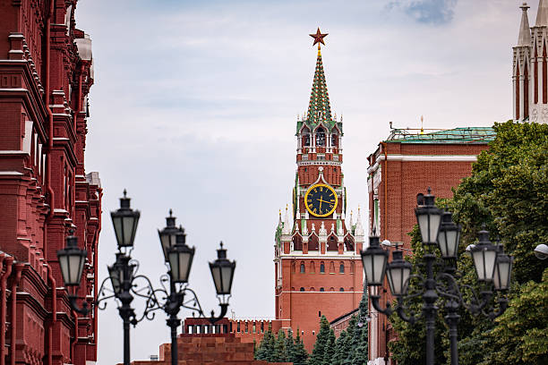 Spasskaya tower, a landmark of Moscow, rising above Kremlin walls with historical buildings visible