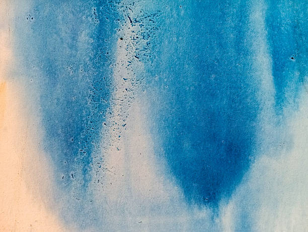 An abstract composition dominated by deep and light shades of blue, crossed by a soft central light.The grainy texture and irregular marks evoke matter, water, or a mineral surface.The whole creates a calm and contemplative atmosphere, reminiscent of the depth of the ocean or the sky.