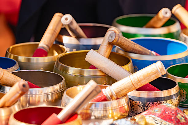 Tibetan singing bowls displayed with mallets, promoting sound therapy, mindfulness, and zen