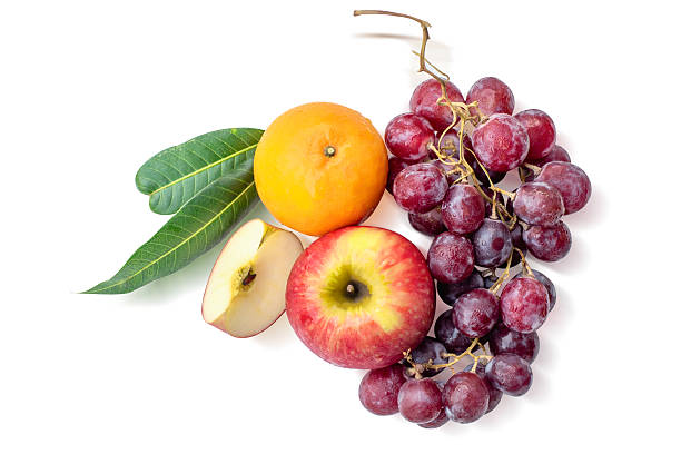Fresh Mixed Fruits Set with Red Apple Slices and Grapes Isolated on White Background