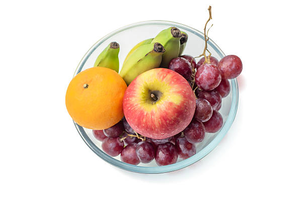 Vibrant Mixed Fruits in Glass Bowl Isolated on White Background