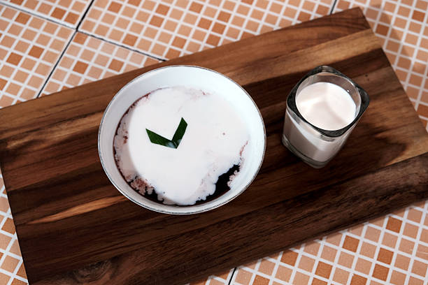 Bubur ketan hitam. Black sticky rice porridge is a dessert made from sticky rice boiled with excess water until soft, and usually served with coconut milk