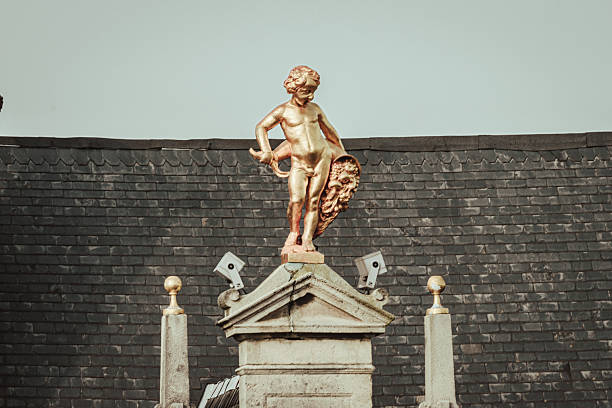 Angel statue on a roof in Antwerp, Belgium
