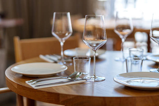 Elegant Restaurant Table Setting with Wine Glasses and Plates