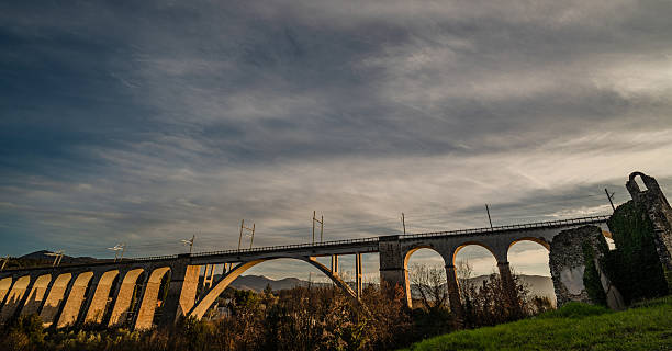 Destroyed in the Allied bombings of 1943, it was rebuilt in its current form. It is supported by two sets of arches separated by a large arch spanning the Carpino River.