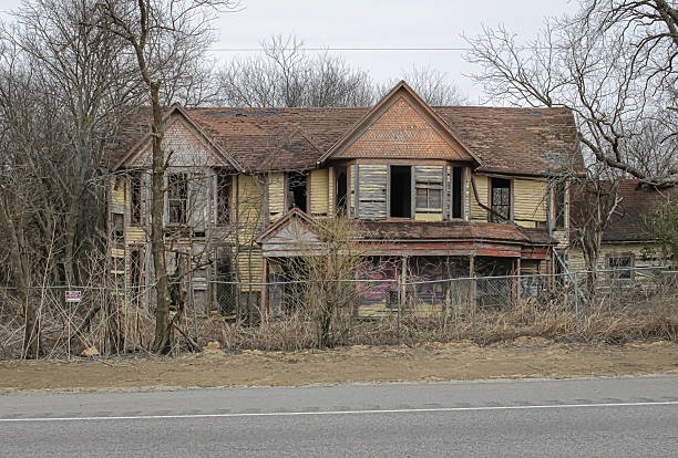 An abandoned house with colorful, Victorian-era architecture in Midlothian, Texas