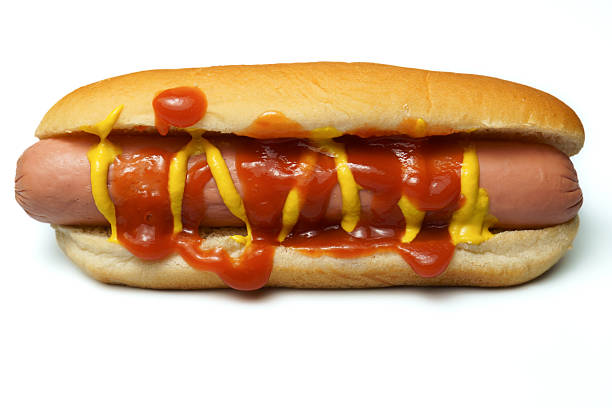 Hot dog with ketchup and mustard on bun