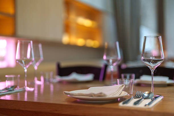 Elegant Restaurant Table Setting with Wine Glasses and Plates