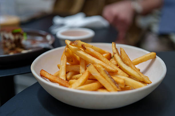 Crispy Golden French Fries in a White Bowl