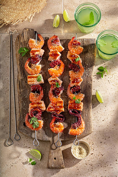 Spicy roasted skewer served with lime and coriander.