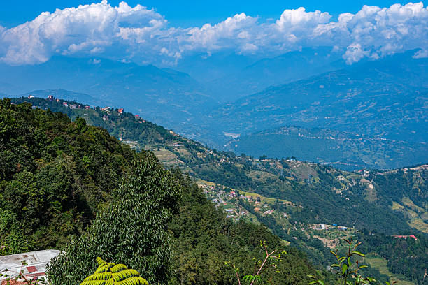 Settlements and farmed terraces rise up Himalayan foothills as seen from Nagarkot, Nepal