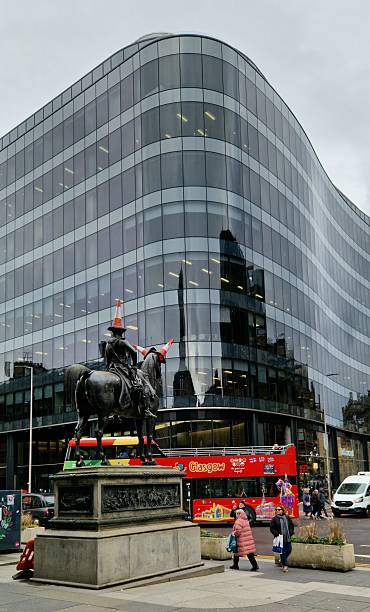 Glasgow, Scotland, United Kingdom - 9 March 2026: Duke of Wellington statue and red Glasgow bus, Royal Exchange Square, Glasgow, Scotland, United Kingdom
