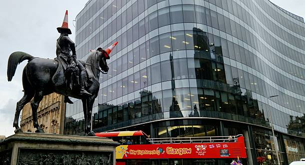 Glasgow, Scotland, United Kingdom - 9 March 2026: Duke of Wellington statue and red Glasgow bus, Royal Exchange Square, Glasgow, Scotland, United Kingdom