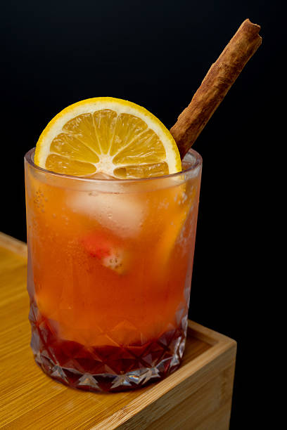 Layered Orange Citrus Energy Mocktail with Cinnamon Stick and Orange Slice Garnish, Refreshing Healthy Vitamin C Drink in Crystal Glass on Wooden Surface 6