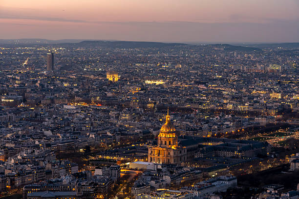 Paris, France - 03 03 2026: Montparnasse Tower: Panoramic view of Hotel des Invalides and Arc de Triomphe at sunset from the rooftop