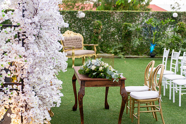 Elegant Floral Arrangement Centered Table Surrounded by Wedding Ceremony Decor Setting