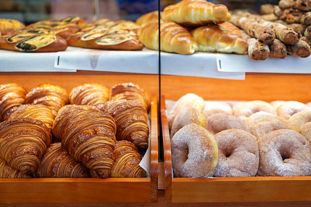Assorted freshly baked pastries on display in a bakery