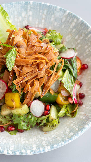 Middle Eastern Arabic food Meze bowl with fattoush salad and pomegranate seed topping served in Lebanese gourmet Restaurant
