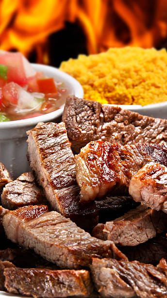 Grilled picanha with rice, farofa and salad