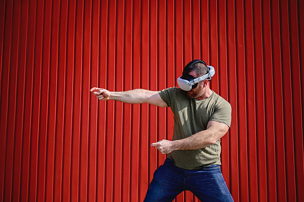 Man exploring virtual reality gaming with VR headset simulating action