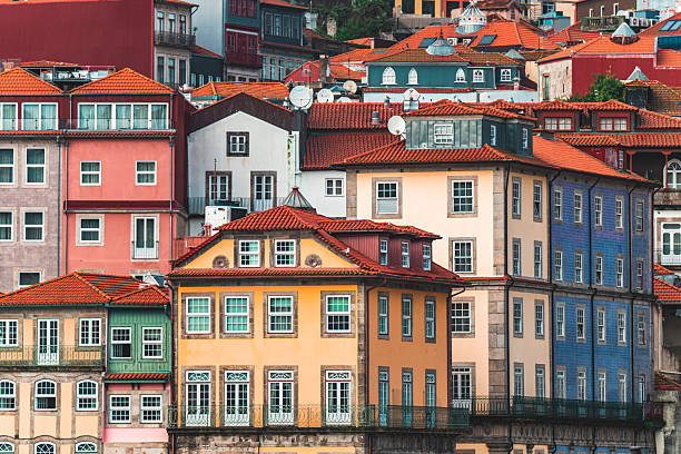 Old, colorful houses with traditional architecture lining the historic ribeira district in porto, portugal