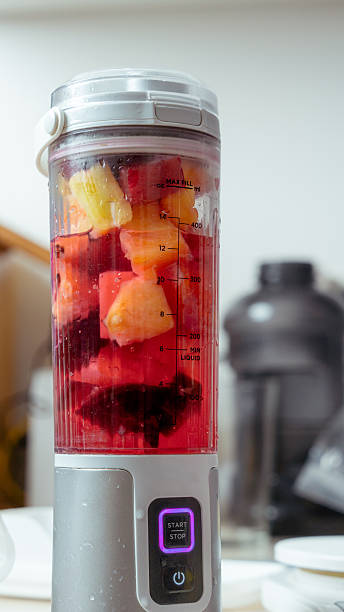 Portable blender making healthy fruit smoothie