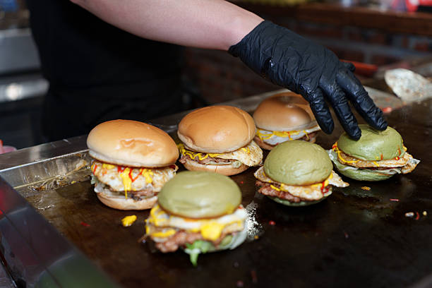 hands making burger