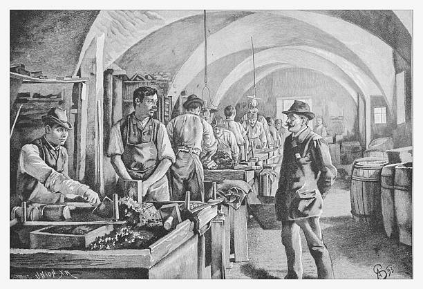 Authentic 19th-century engraving from 1893, depicting a busy mosaic workshop. Craftsmen are meticulously preparing marble slabs and tesserae at their workbenches, while a supervisor or owner observes the manual labor. This genre scene illustrates a manufacturing process and working conditions in a vaulted room during the late Industrial Revolution.