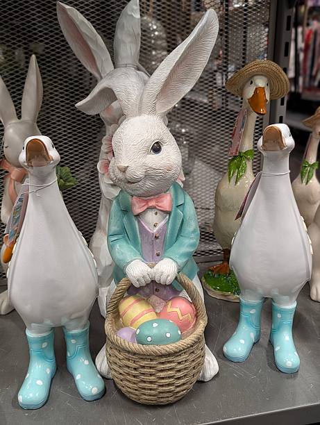 Pastel Rabbit With Eggs. Festive Display Of Ceramic Rabbit Surrounded By Colorful Eggs And Charming Statuettes