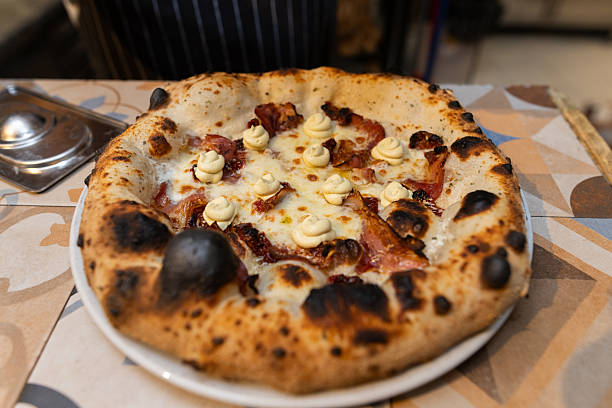 Wood-Fired Neapolitan Pizza With Charred Crust, Melted Cheese and Gourmet Toppings