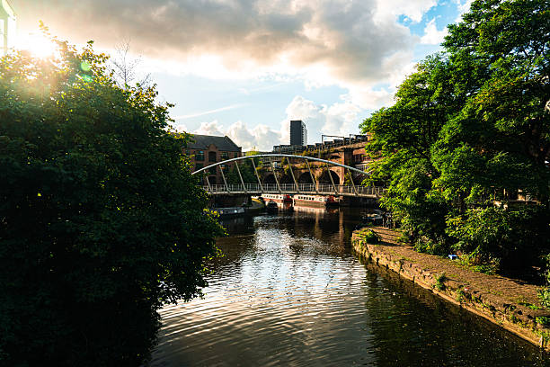 Rochdale canal and merchants bridge in castlefield, manchester, england during sunset
